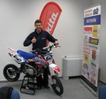 Klemen ob novi pridobitvi, motociklu znamke Stomp, ki mu bo zagotavljal mobilnost v boksih...